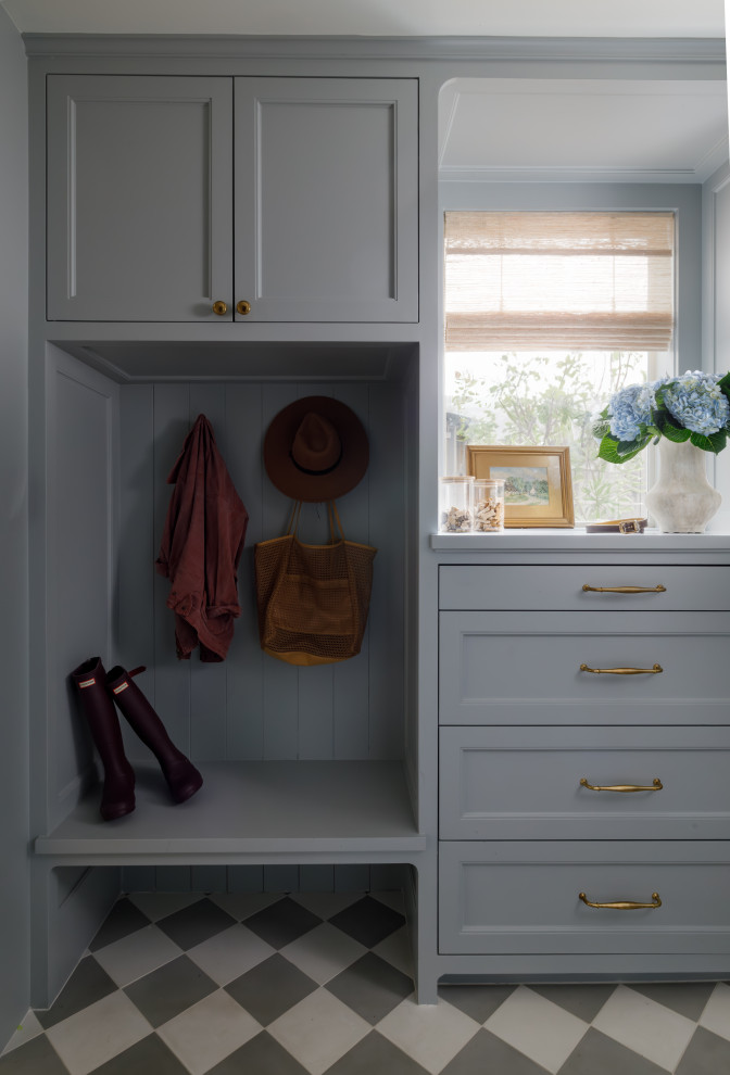 Inspiration for a mid-sized traditional mudroom in Houston with blue walls, ceramic floors, a single front door, a blue front door and grey floor.