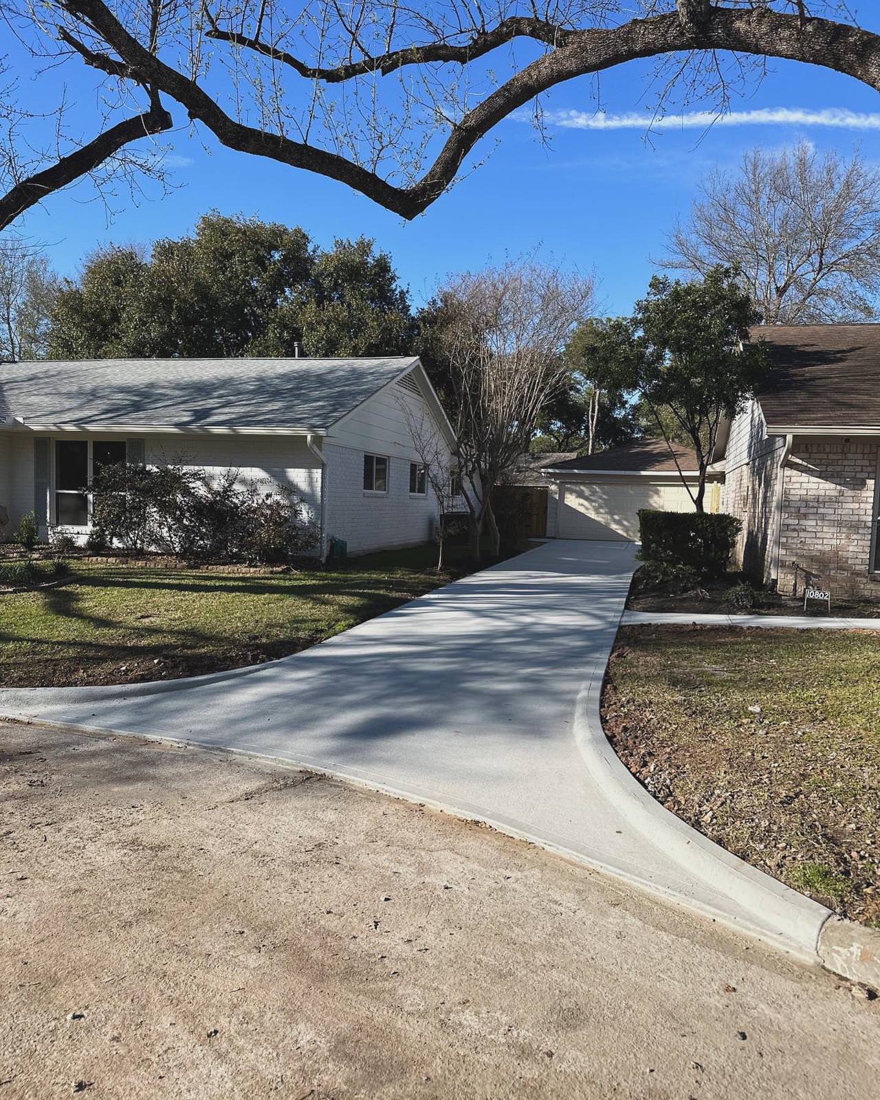 New driveway with sidewalks and stamped concrete!