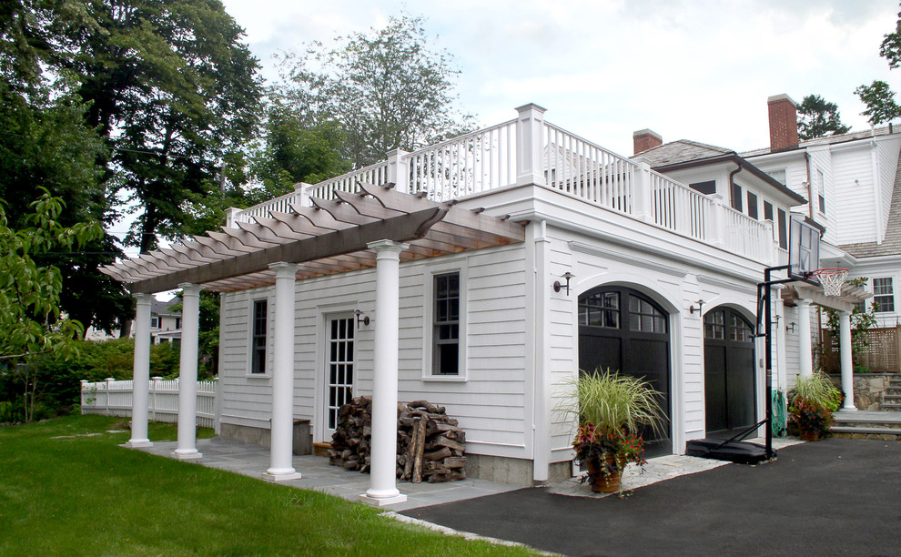 This is an example of a mid-sized traditional attached two-car garage in Boston.