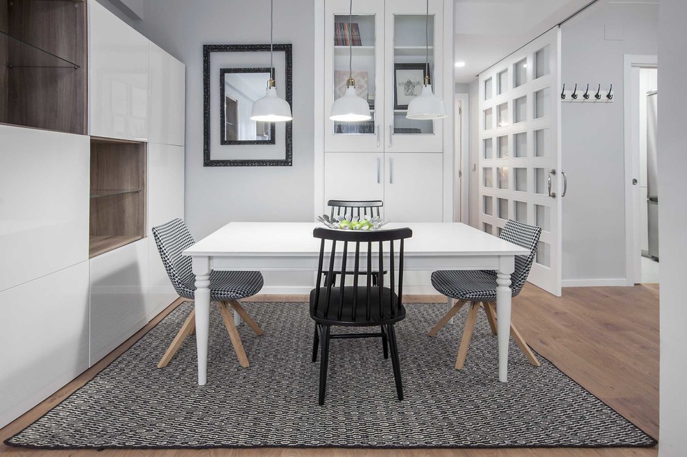 This is an example of a mid-sized scandinavian open plan dining in Other with medium hardwood floors.