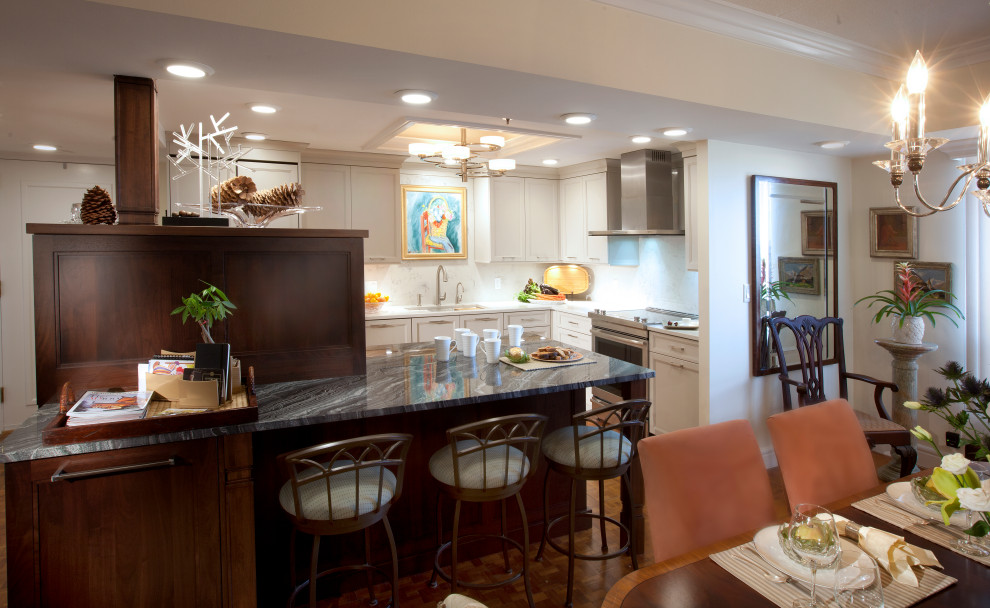 Inspiration for a transitional eat-in kitchen remodel with an undermount sink, flat-panel cabinets, granite countertops, stainless steel appliances and an island