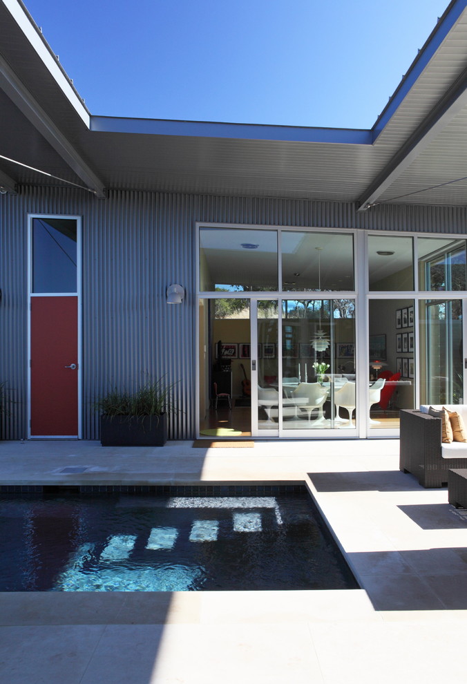 This is an example of a contemporary exterior in Austin with metal siding.