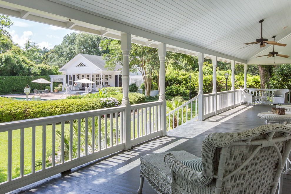 Expansive country side yard verandah in Miami with decking and a roof extension.