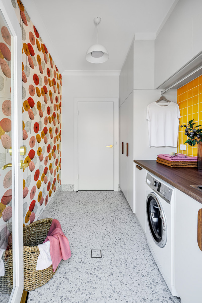 Photo of a midcentury laundry room in Other.