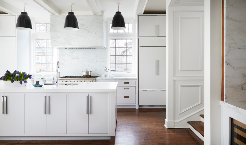 Inspiration for a mid-sized transitional galley medium tone wood floor open concept kitchen remodel in Chicago with a double-bowl sink, beaded inset cabinets, white cabinets, quartz countertops, white backsplash, marble backsplash, paneled appliances and an island