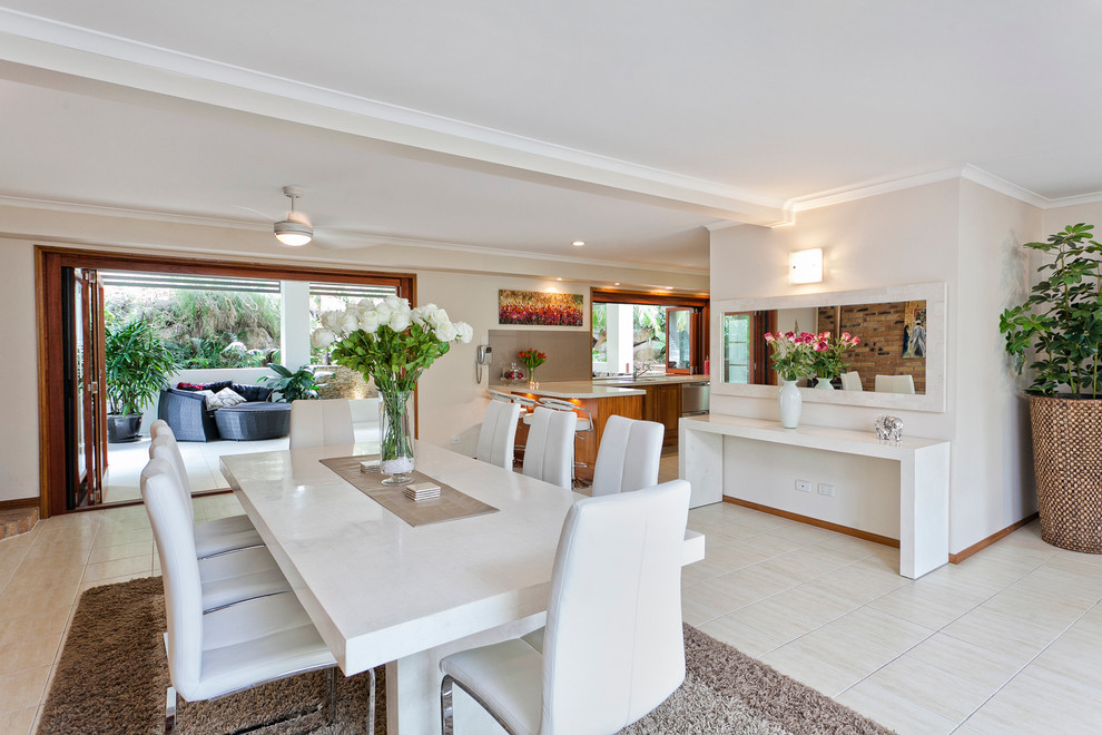 Design ideas for a large contemporary open plan dining in Brisbane with white walls.