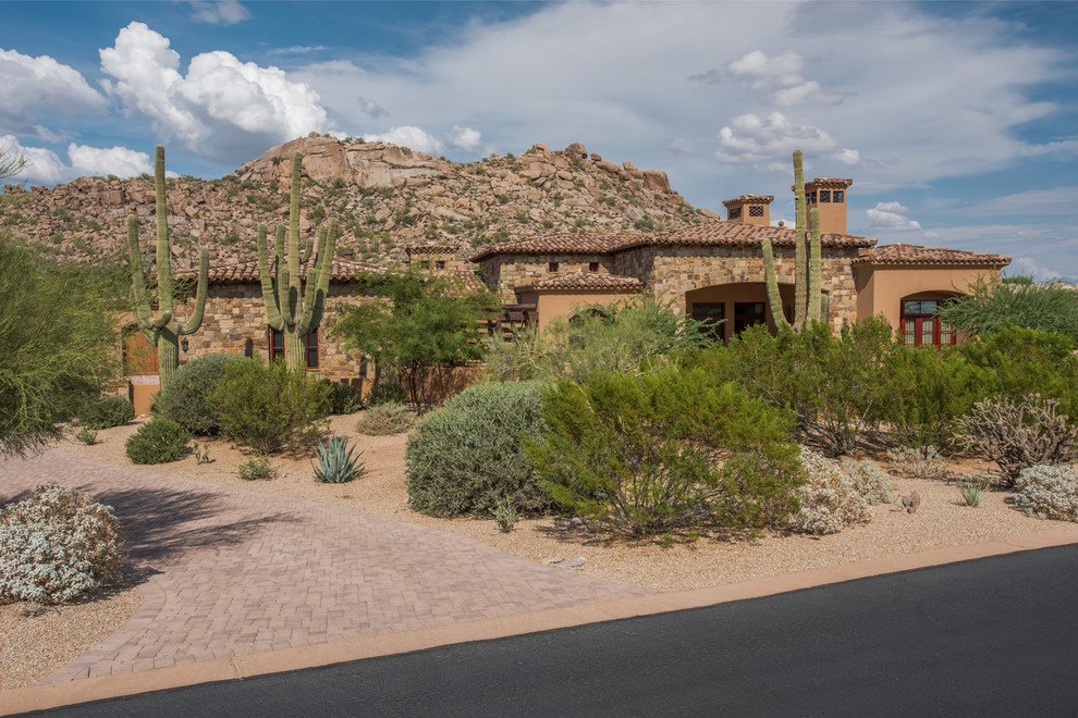 Example of a huge transitional concrete floor front door design in Phoenix with beige walls and a glass front door
