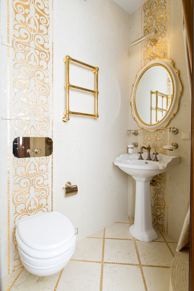 Design ideas for a traditional powder room in Moscow with a wall-mount toilet, white tile and a pedestal sink.