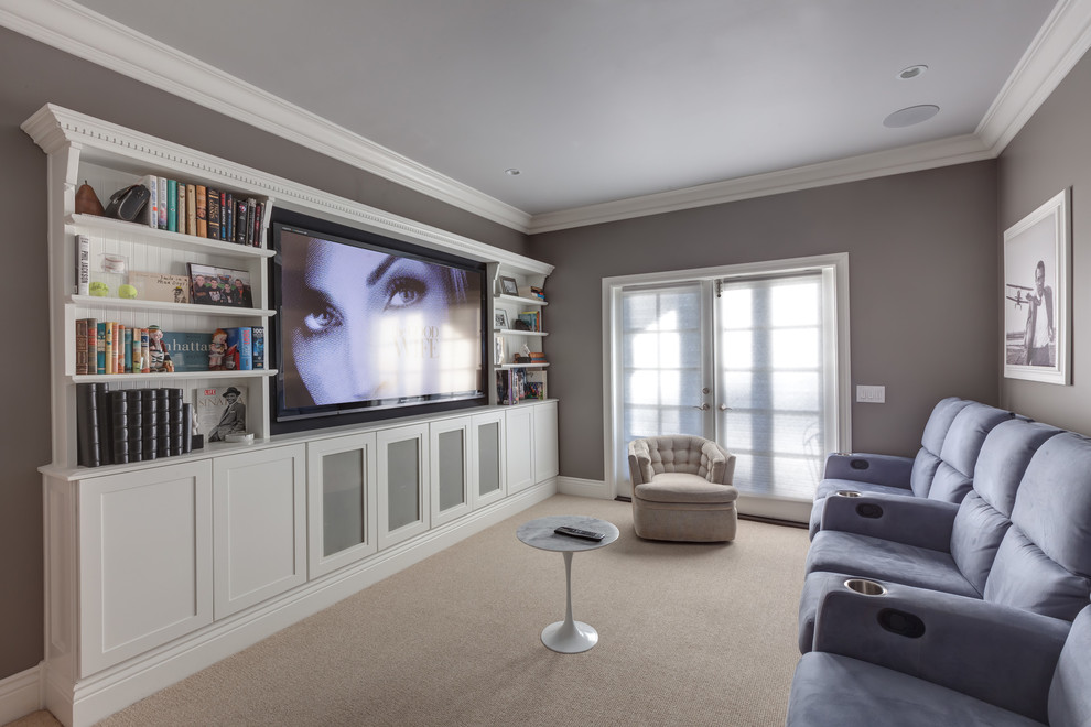 Inspiration for a mid-sized traditional enclosed home theatre in Los Angeles with grey walls, carpet, a built-in media wall and beige floor.