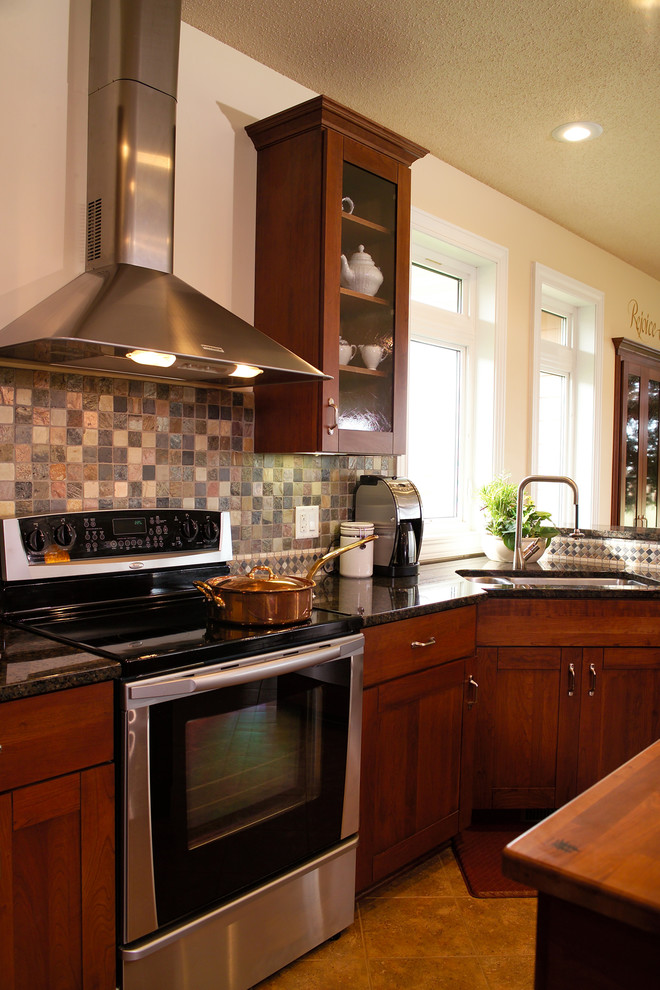 Open concept kitchen - large transitional u-shaped porcelain tile open concept kitchen idea with an undermount sink, recessed-panel cabinets, dark wood cabinets, granite countertops, gray backsplash, ceramic backsplash, stainless steel appliances and two islands