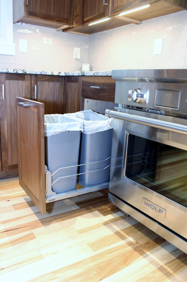 Inspiration for a mid-sized transitional l-shaped kitchen remodel with shaker cabinets, dark wood cabinets, ceramic backsplash, stainless steel appliances, an island and multicolored countertops
