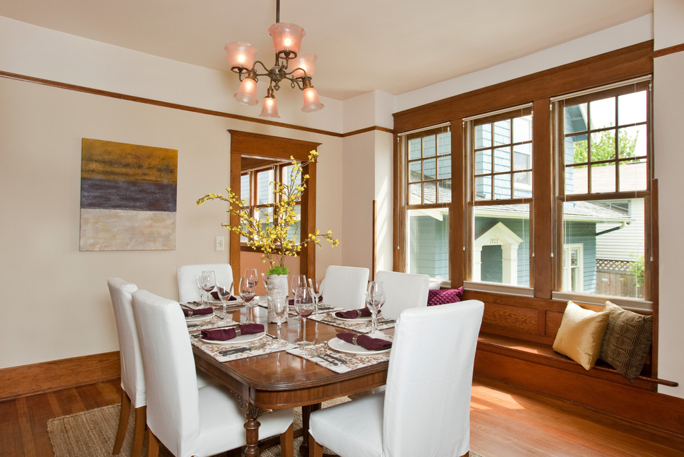 Inspiration for a mid-sized traditional separate dining room in Los Angeles with white walls, medium hardwood floors, no fireplace and brown floor.