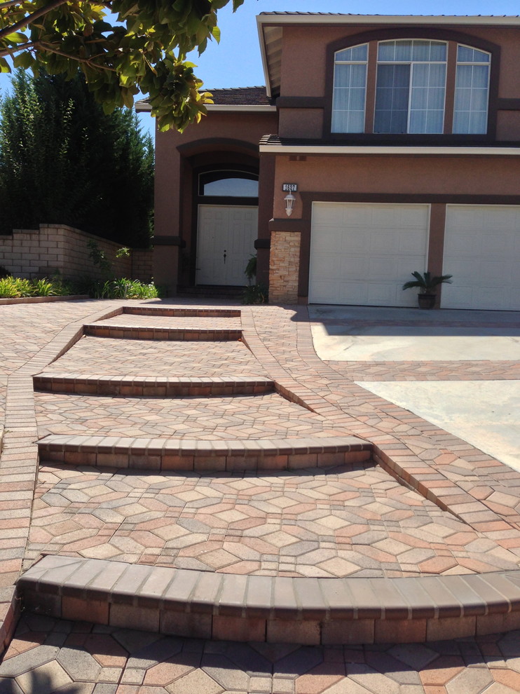 Inspiration for a large transitional front door remodel in Orange County with a white front door