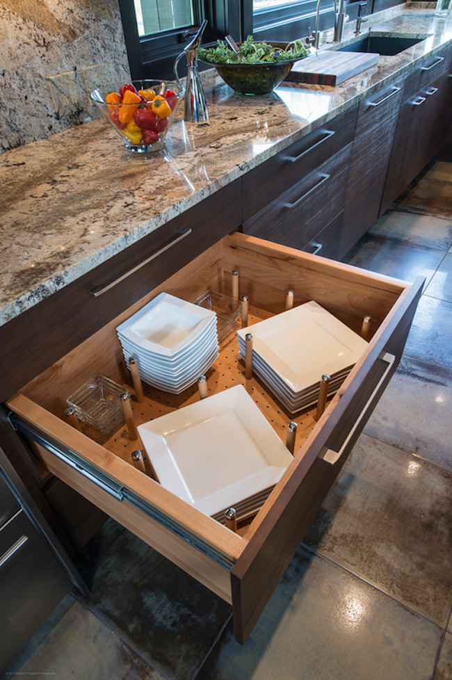 Inspiration for a large contemporary l-shaped open plan kitchen in Denver with a drop-in sink, flat-panel cabinets, dark wood cabinets, marble benchtops, beige splashback, stainless steel appliances, with island and stone slab splashback.