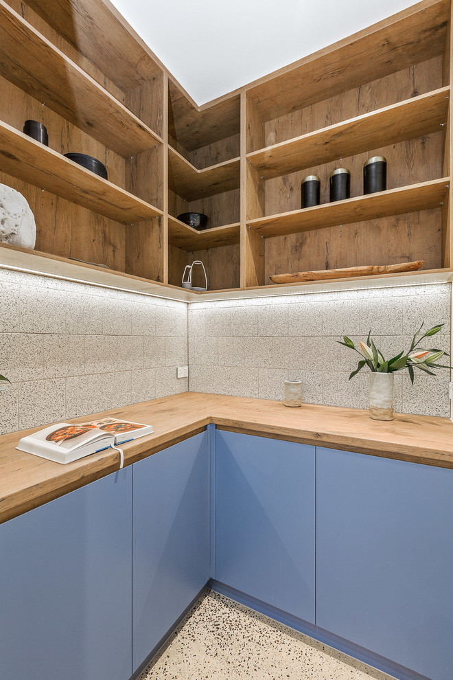 This is an example of a mid-sized contemporary kitchen pantry in Melbourne with an undermount sink, medium wood cabinets, concrete benchtops, window splashback, concrete floors, with island, grey floor and grey benchtop.
