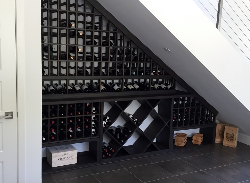 Design ideas for a small traditional wine cellar in Los Angeles with display racks.