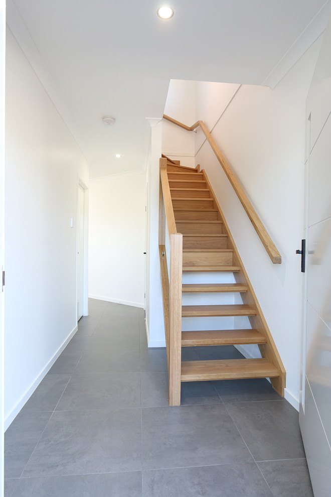 Design ideas for a mid-sized contemporary wood l-shaped staircase in Brisbane with wood risers.