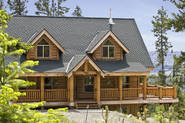 Design ideas for a mid-sized country two-storey exterior in Other with wood siding.