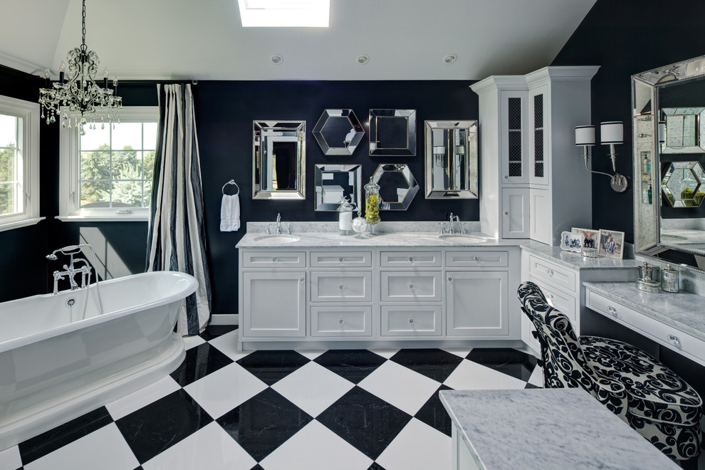 Traditional bathroom in Chicago with an undermount sink, shaker cabinets, white cabinets, a freestanding tub, black walls and multi-coloured floor.