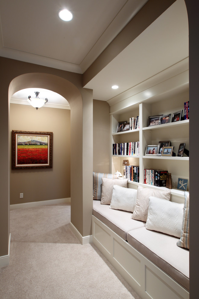 Photo of a large traditional hallway in Grand Rapids with beige walls and carpet.