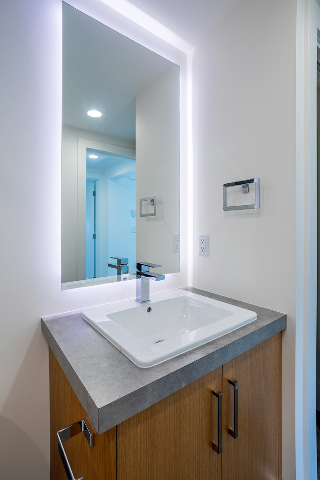 Small contemporary master bathroom in Other with white tile, white walls, concrete floors and grey floor.