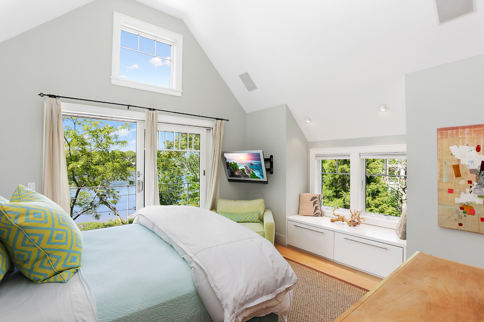 Example of a transitional bedroom design in New York with gray walls