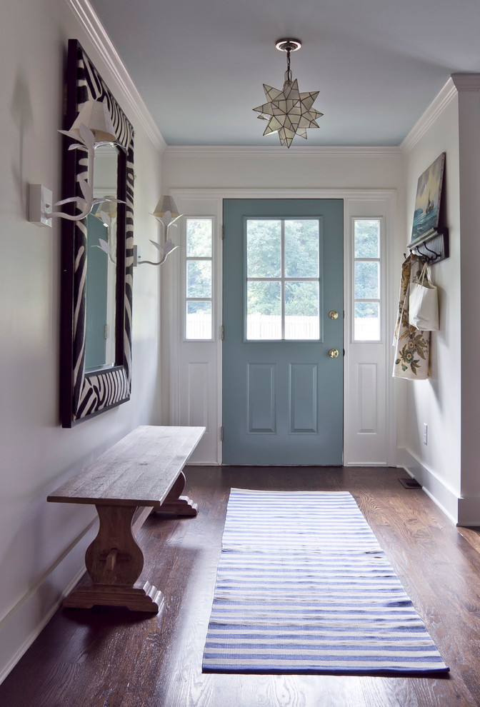 Entry hall - eclectic brown floor entry hall idea in Atlanta with a blue front door