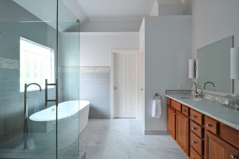 Design ideas for a modern bathroom in Atlanta with shaker cabinets and a freestanding tub.
