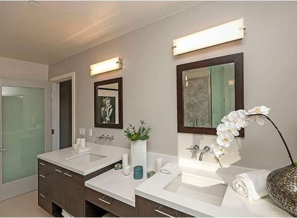 Photo of a large contemporary master bathroom in Los Angeles with an undermount sink, flat-panel cabinets, dark wood cabinets, engineered quartz benchtops, a freestanding tub, a corner shower, gray tile, ceramic tile, white walls and ceramic floors.