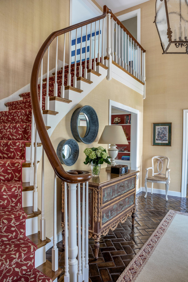 Photo of a mid-sized transitional wood floating staircase in Boston with wood risers and wood railing.