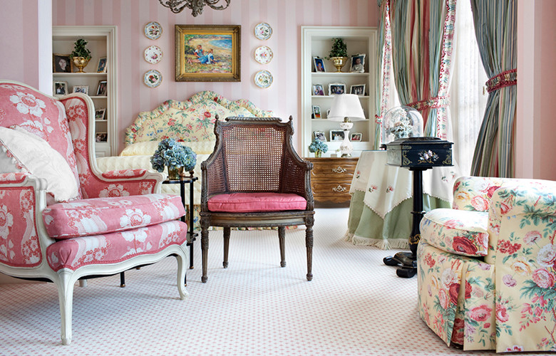 This is an example of a mid-sized traditional bedroom in Atlanta with pink walls, carpet and no fireplace.