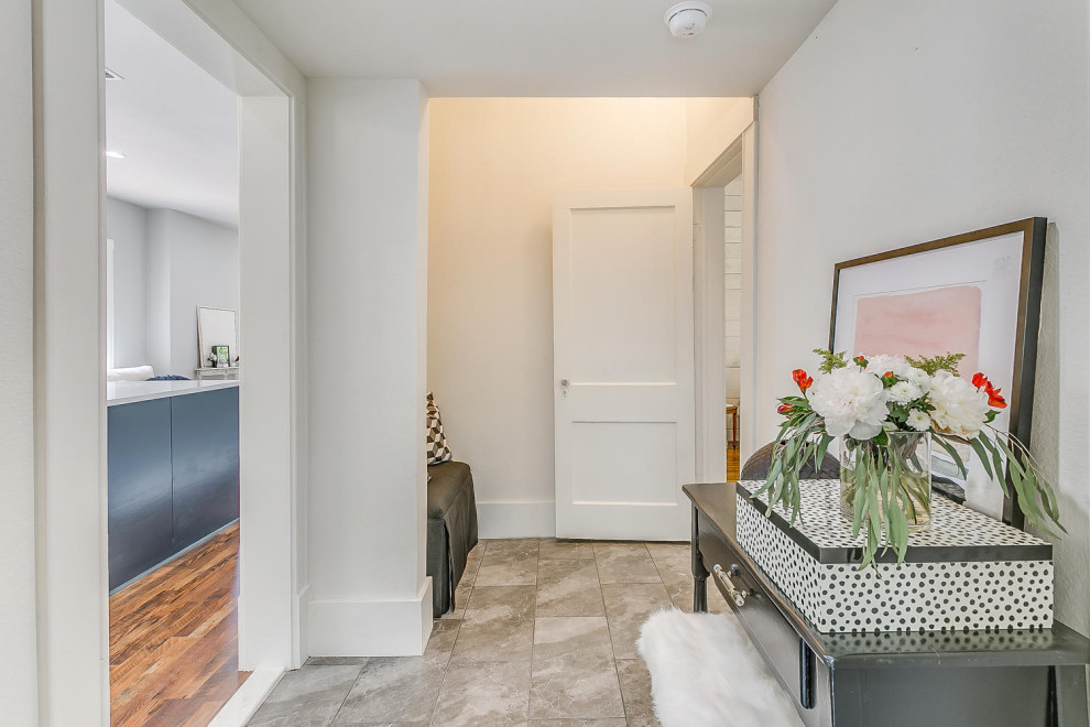 Hallway - small transitional concrete floor, gray floor and shiplap ceiling hallway idea with white walls