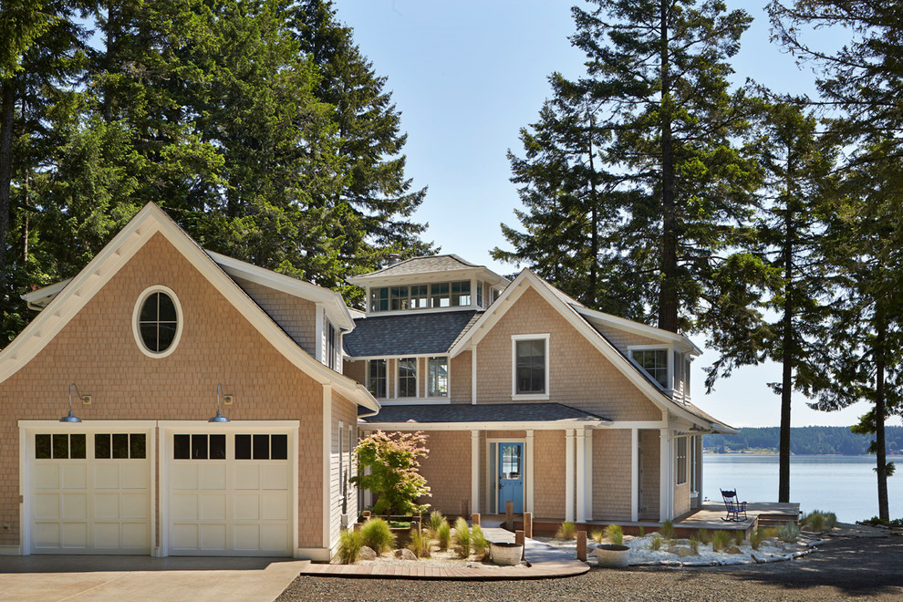 Coastal beige two-story exterior home idea in Seattle
