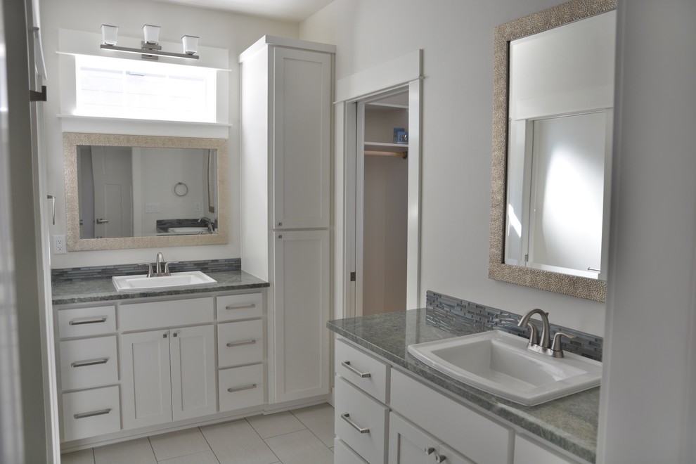 Mid-sized arts and crafts master bathroom in Other with shaker cabinets, white cabinets, gray tile, matchstick tile, granite benchtops, grey walls, porcelain floors and an undermount sink.