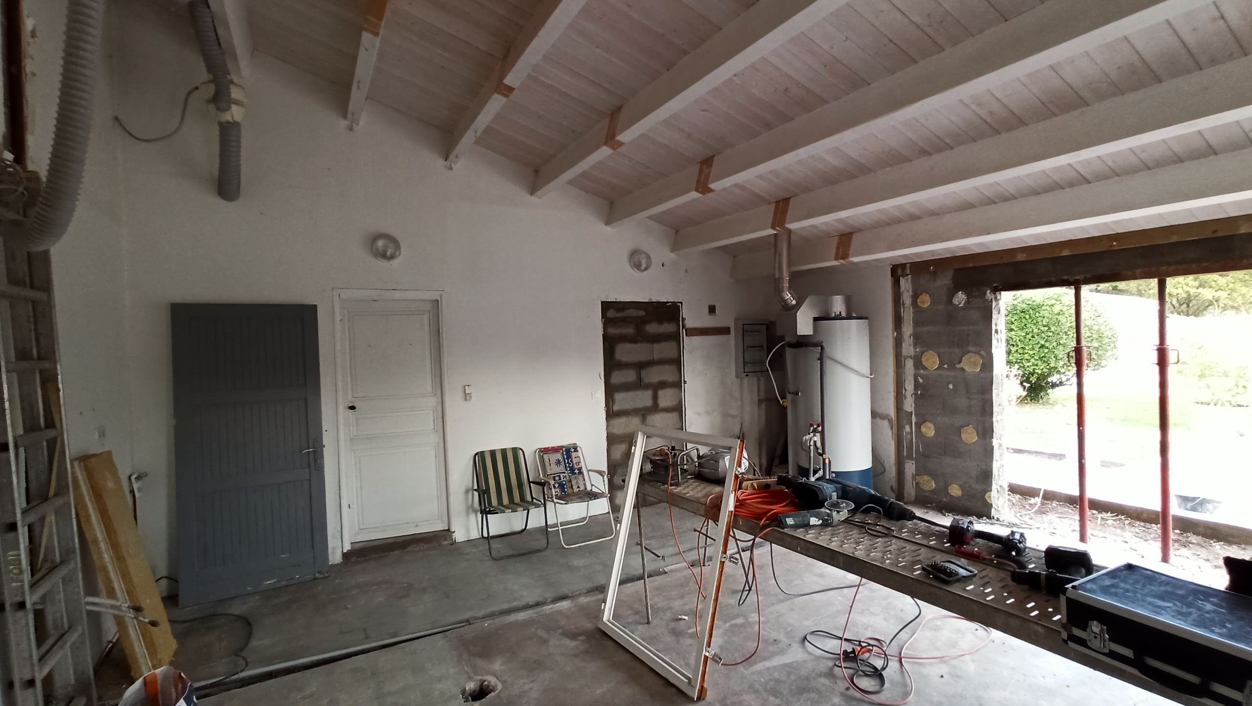 Transformation d'une chambre parentale en pièce de vie/cuisine