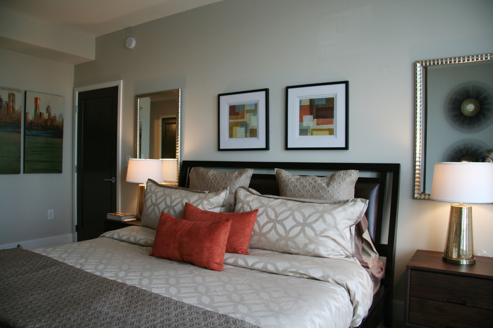 Mid-sized contemporary guest bedroom in New York with carpet and grey walls.