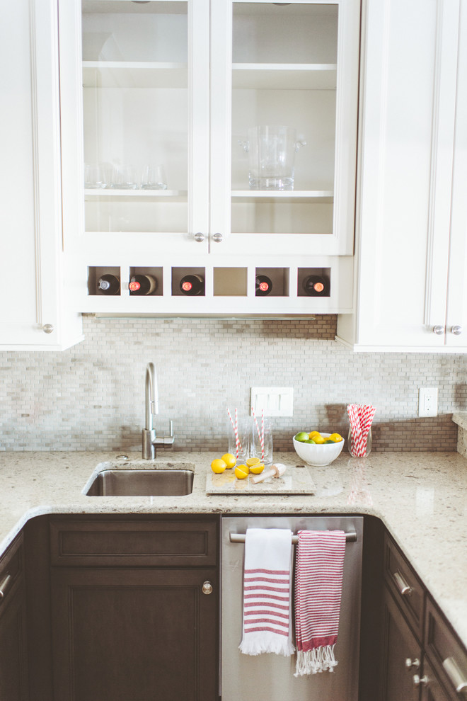 Inspiration for a transitional kitchen remodel with recessed-panel cabinets, no island, a farmhouse sink, white cabinets, subway tile backsplash and stainless steel appliances