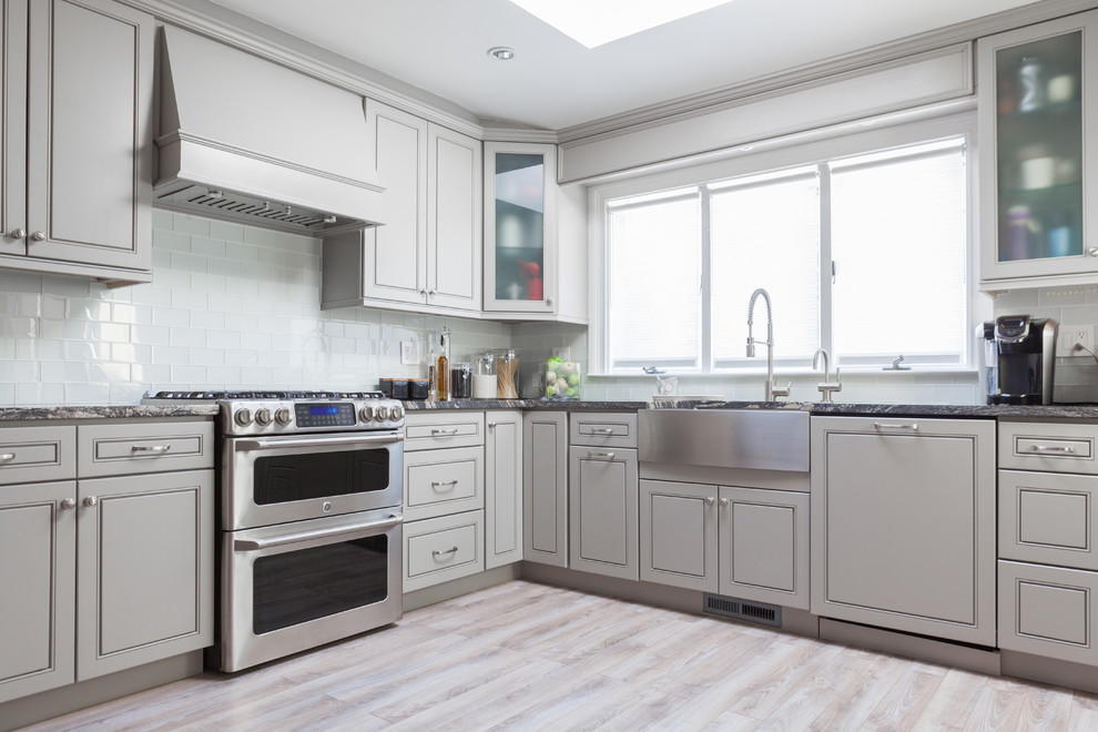 Photo of a contemporary kitchen in New York with shaker cabinets and grey cabinets.