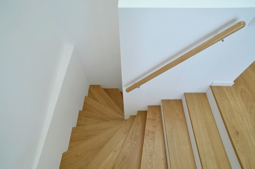 Inspiration for a contemporary painted wood staircase in Berlin.
