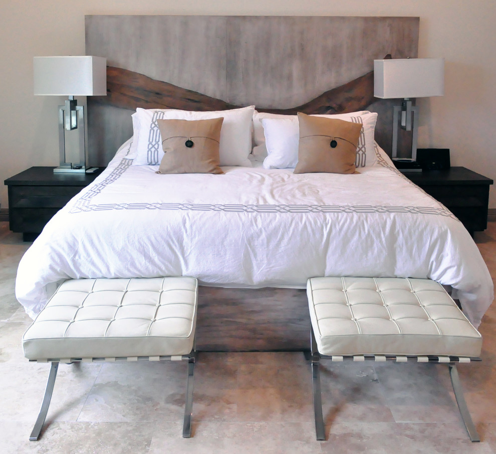 Design ideas for a small contemporary bedroom in Austin with white walls and travertine floors.