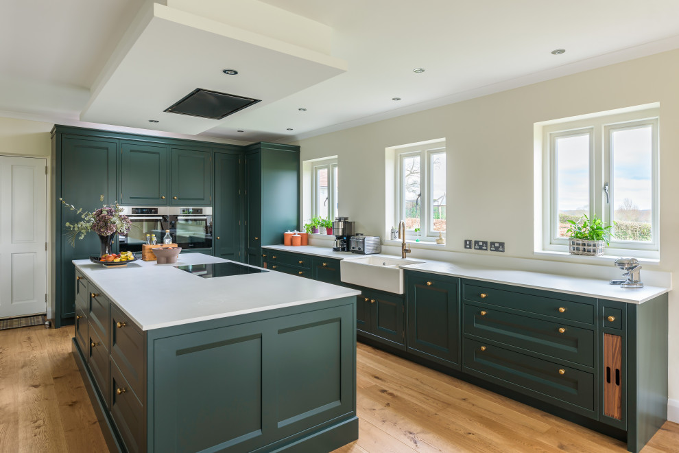 Kitchen - traditional kitchen idea in Sussex with an island