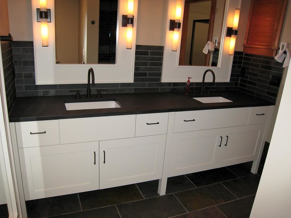 Mid-sized transitional master black tile and ceramic tile ceramic tile bathroom photo in Seattle with recessed-panel cabinets, white cabinets, beige walls, an undermount sink and solid surface countertops