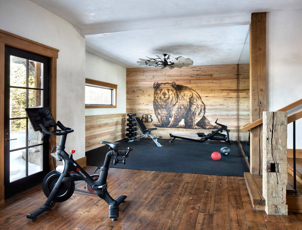 Photo of a rustic home gym in Other with a feature wall.