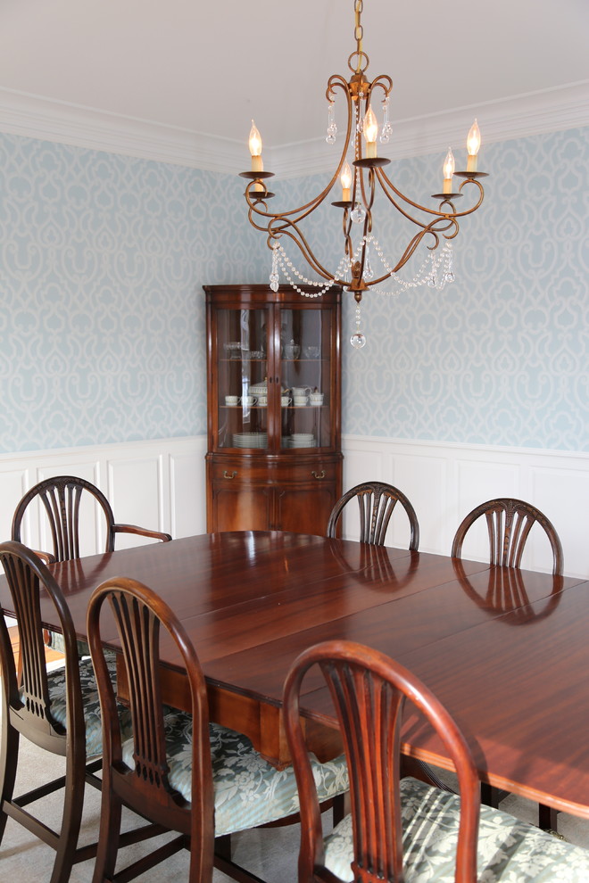 Inspiration for a large traditional separate dining room in New York with blue walls, medium hardwood floors, no fireplace and brown floor.