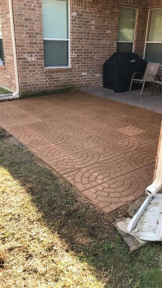 Inspiration for a mid-sized modern rock and partial sun backyard concrete paver landscaping in Houston for summer.
