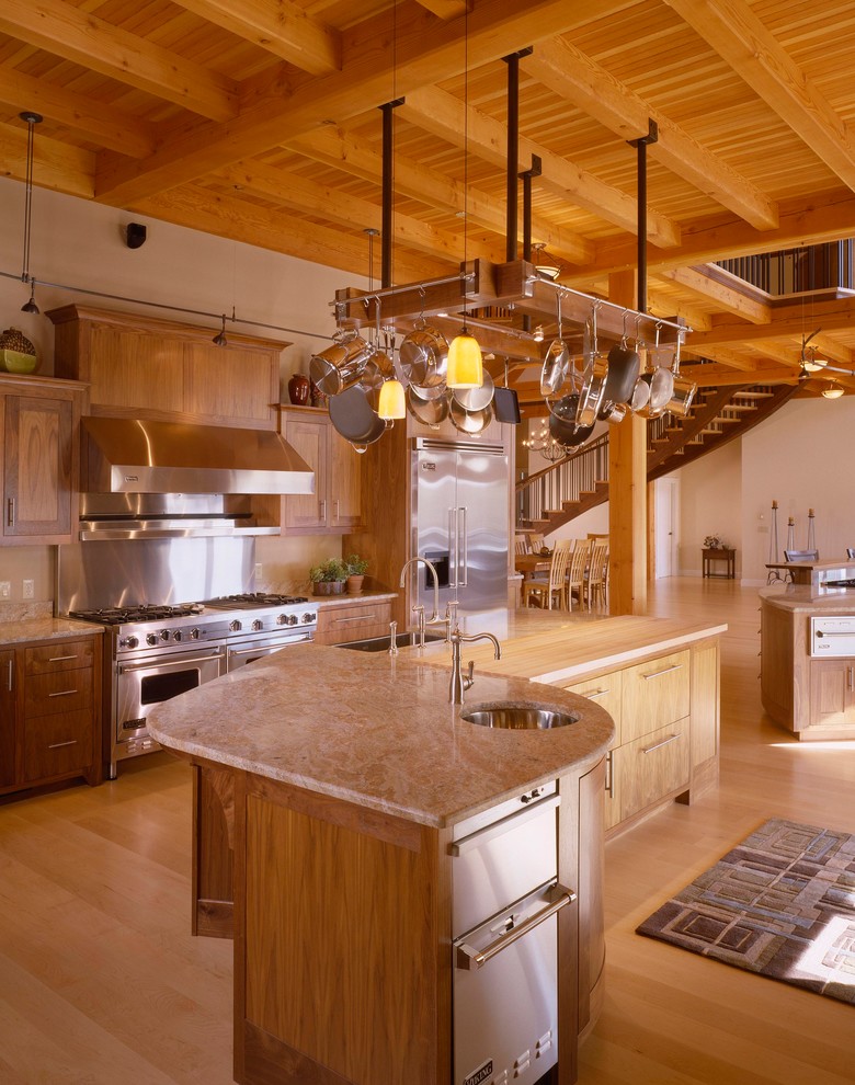 Inspiration for a country open plan kitchen in Portland Maine with flat-panel cabinets and light wood cabinets.
