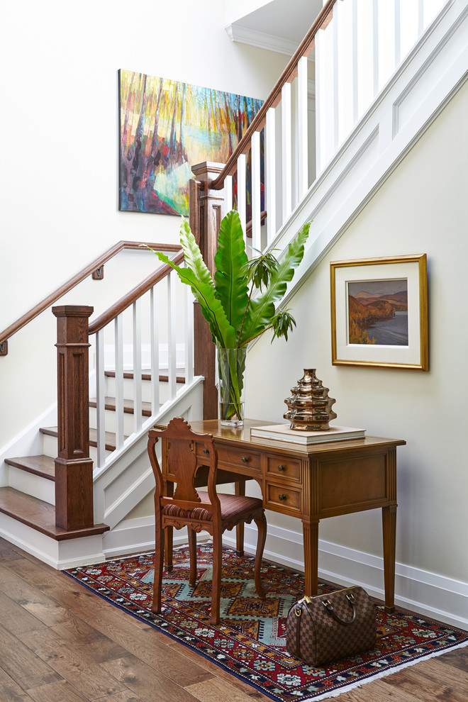 Photo of a traditional foyer in Toronto with beige walls and dark hardwood floors.
