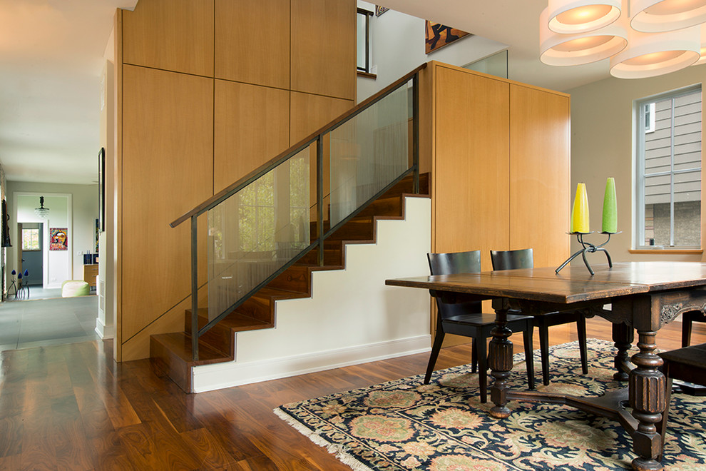 Design ideas for a contemporary wood u-shaped staircase in Chicago with wood risers.