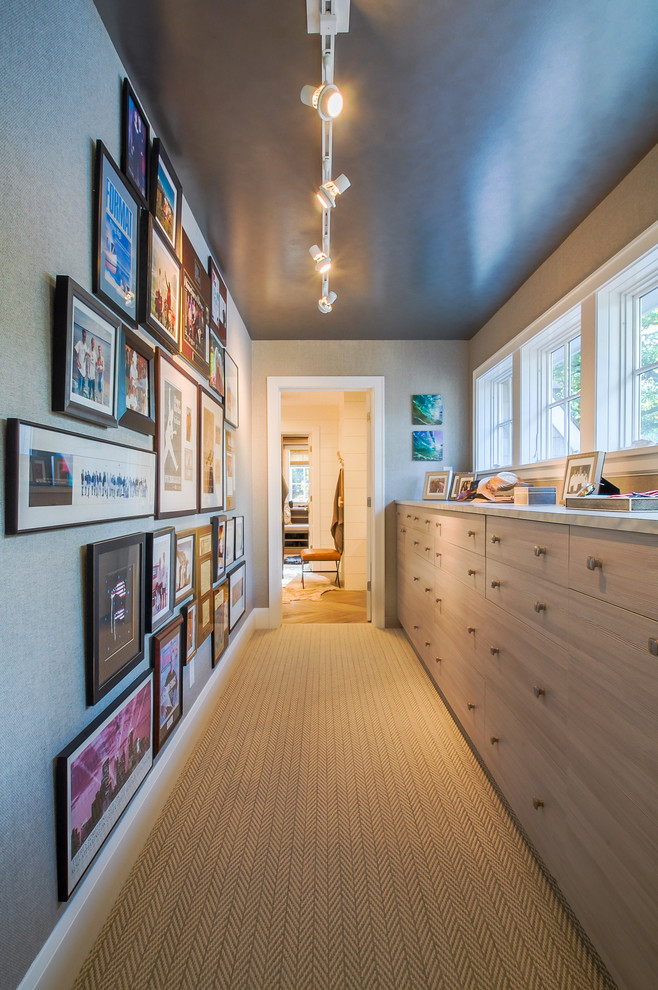 Photo of a mid-sized beach style hallway in Minneapolis with grey walls and carpet.