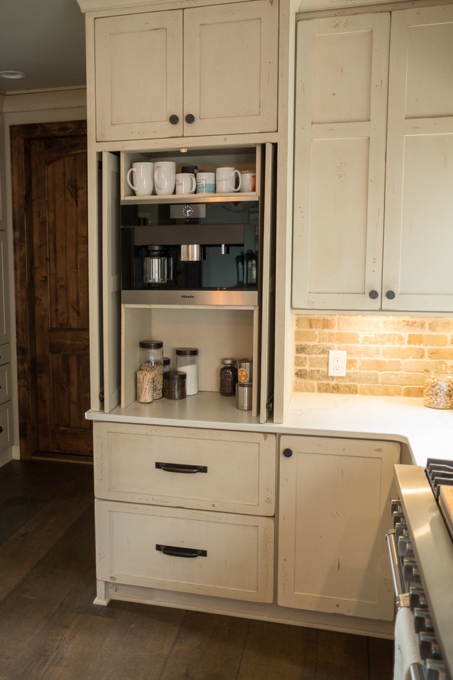 Inspiration for a large transitional galley dark wood floor and brown floor open concept kitchen remodel with a farmhouse sink, shaker cabinets, quartz countertops, brown backsplash, brick backsplash, stainless steel appliances and an island
